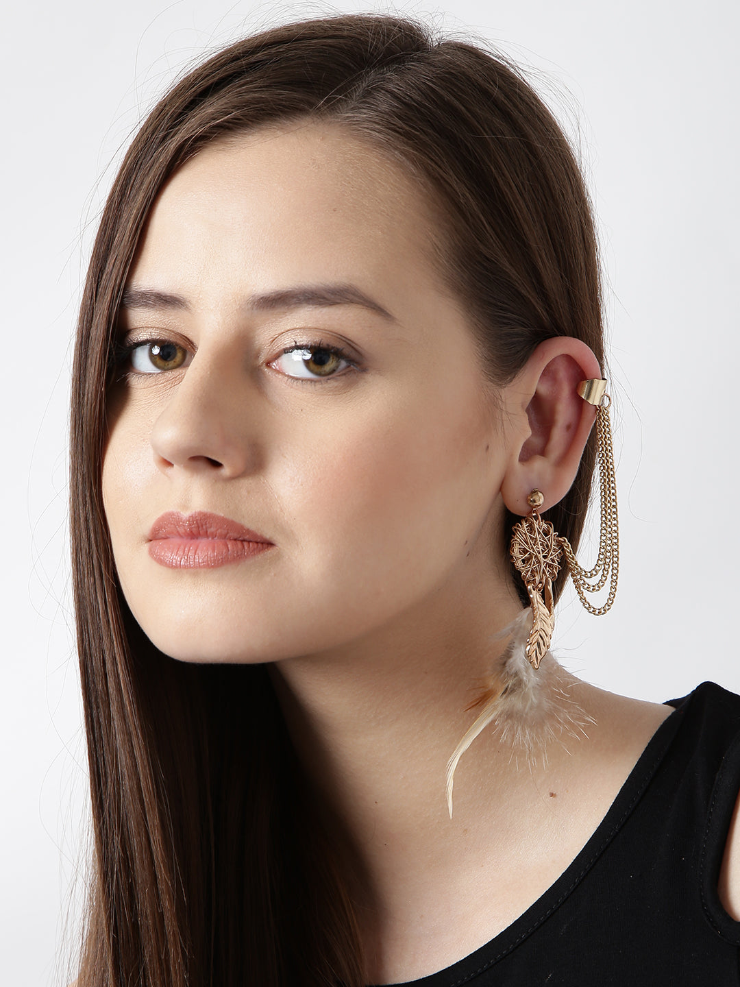 Gold toned feather drop mis match earrings