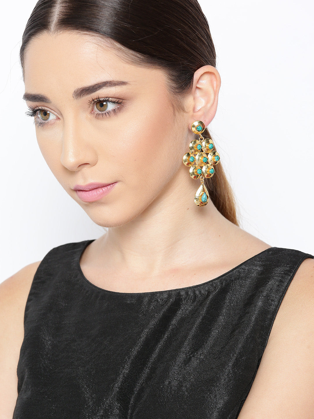 Blueberry golden drop earring has green stone studded