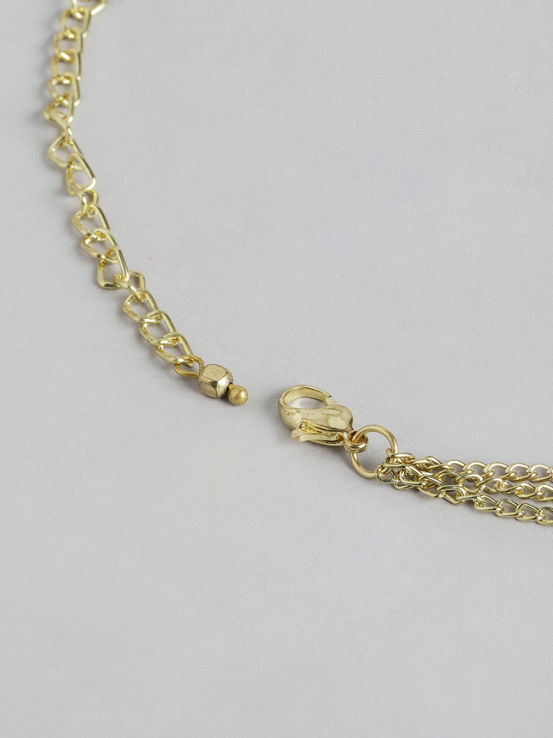 Blueberry Evil Eye pendant detailing layered chain necklace