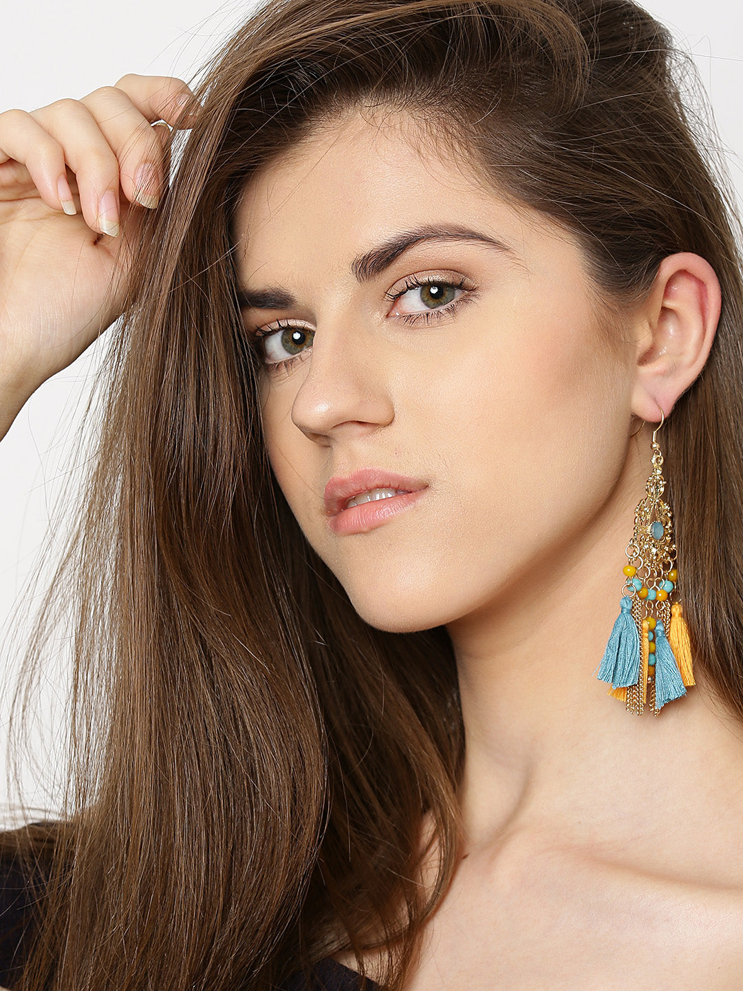 Gold toned stone studded drop earrings