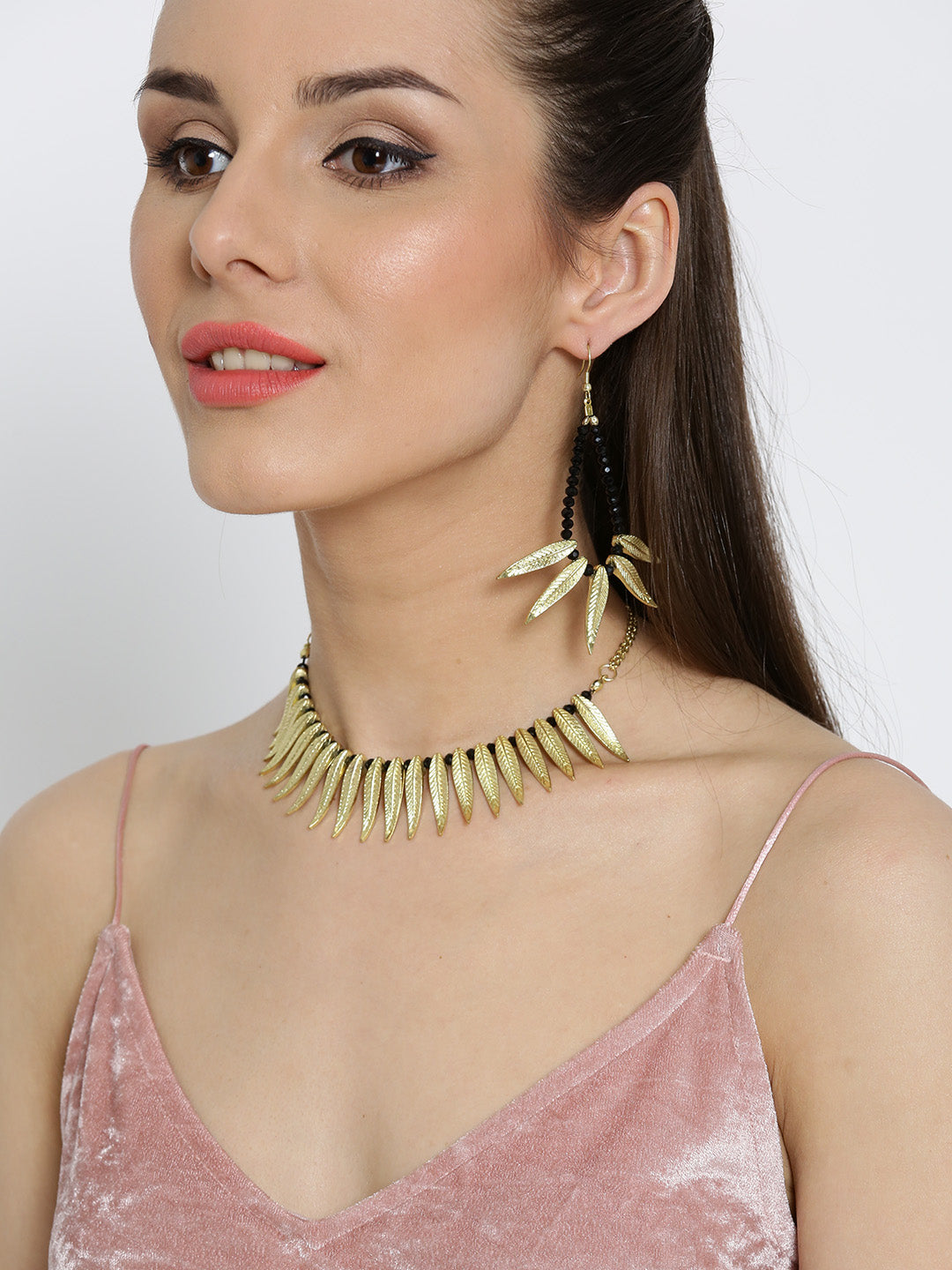 Gold toned leaf choker necklace with earrings